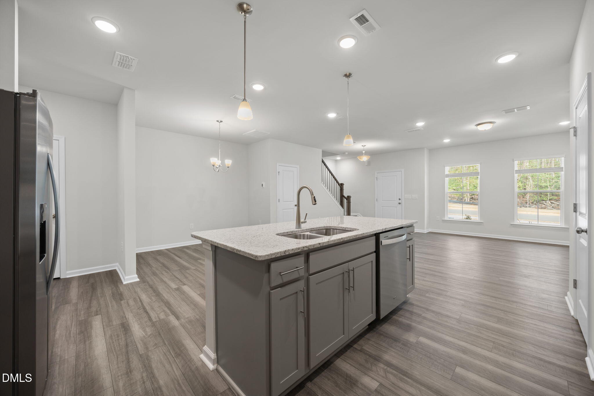 202 Fosterton Cottage Way Raleigh, NC 27603 - Photo 5 of 13 a kitchen with a sink a refrigerator and window