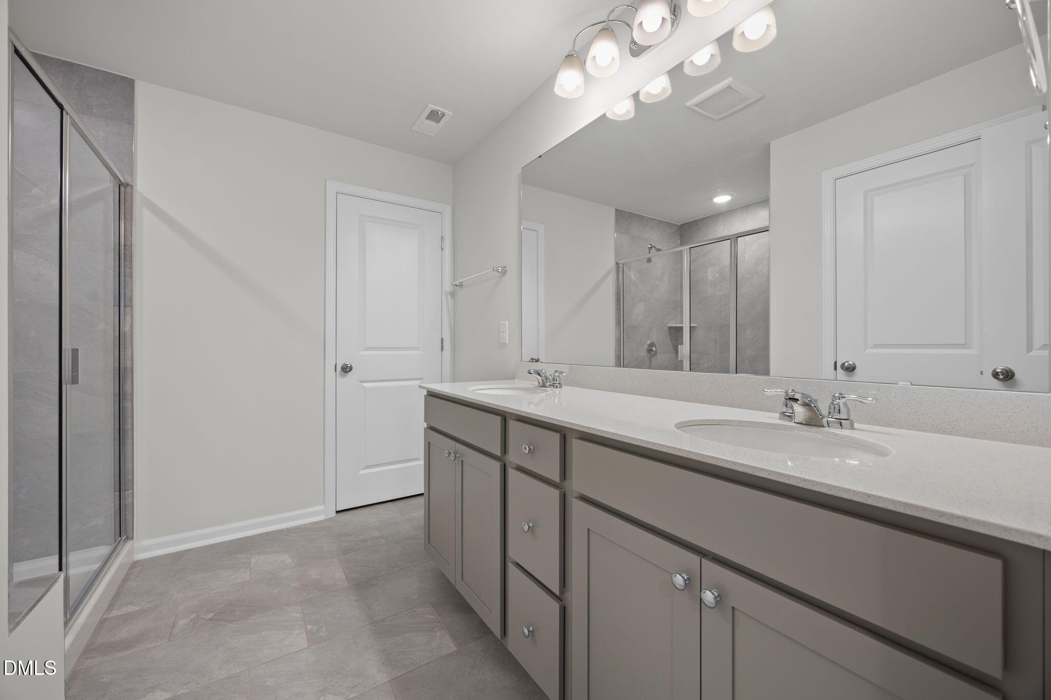 202 Fosterton Cottage Way Raleigh, NC 27603 - Photo 6 of 13 a bathroom with a sink a large mirror and vanity