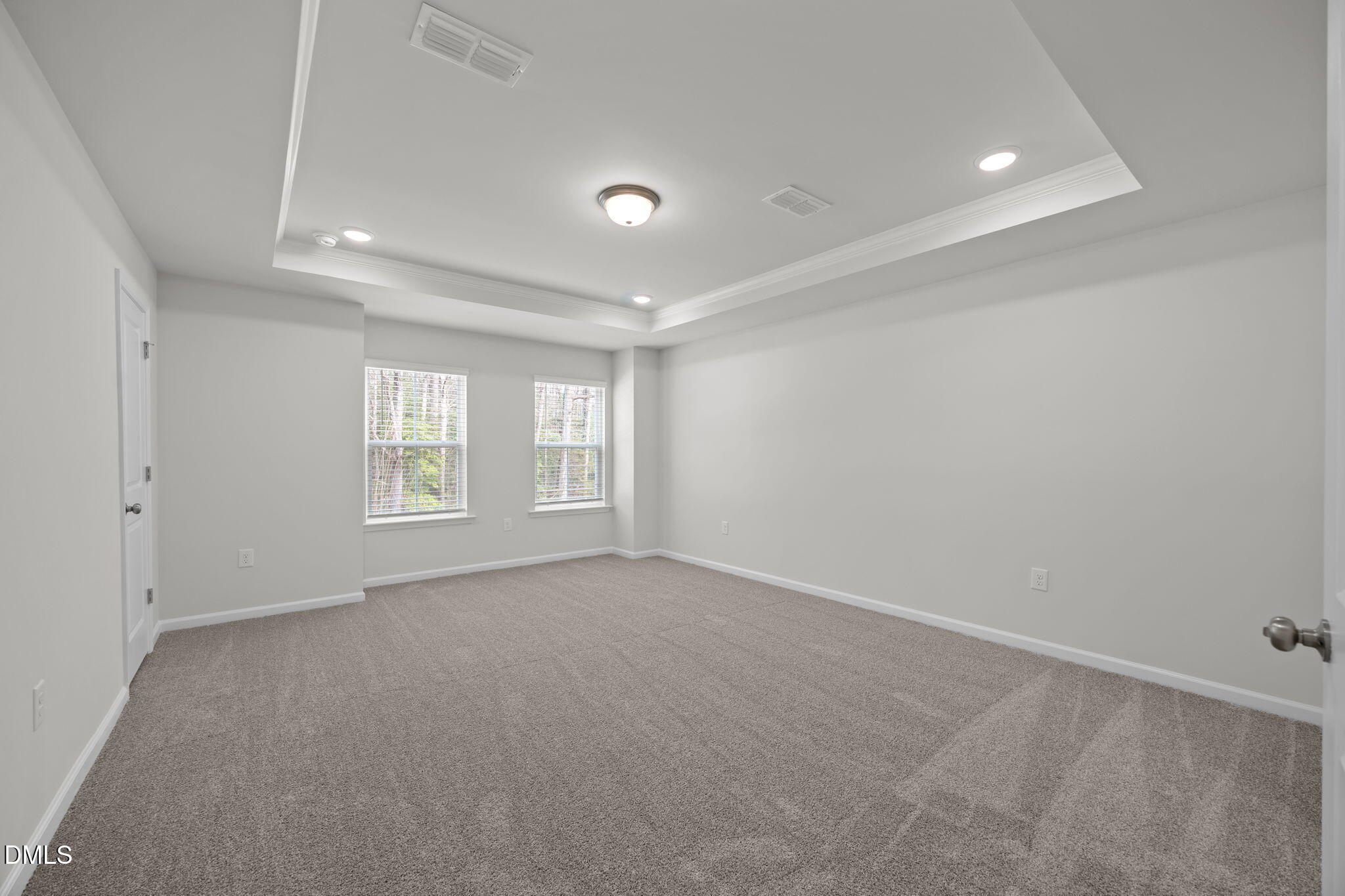 202 Fosterton Cottage Way Raleigh, NC 27603 - Photo 9 of 13 an empty room with windows