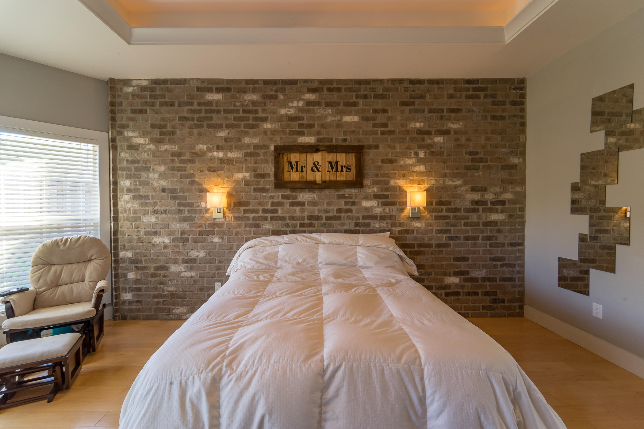 303 Greyfox Circle Crestview, FL 32536 - Photo 12 of 24 a spacious bedroom with a bed and a couch