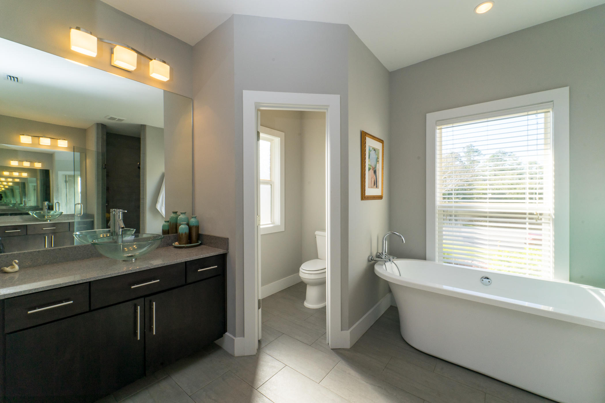 303 Greyfox Circle Crestview, FL 32536 - Photo 15 of 24 a bathroom with a granite countertop sink a toilet and a bathtub