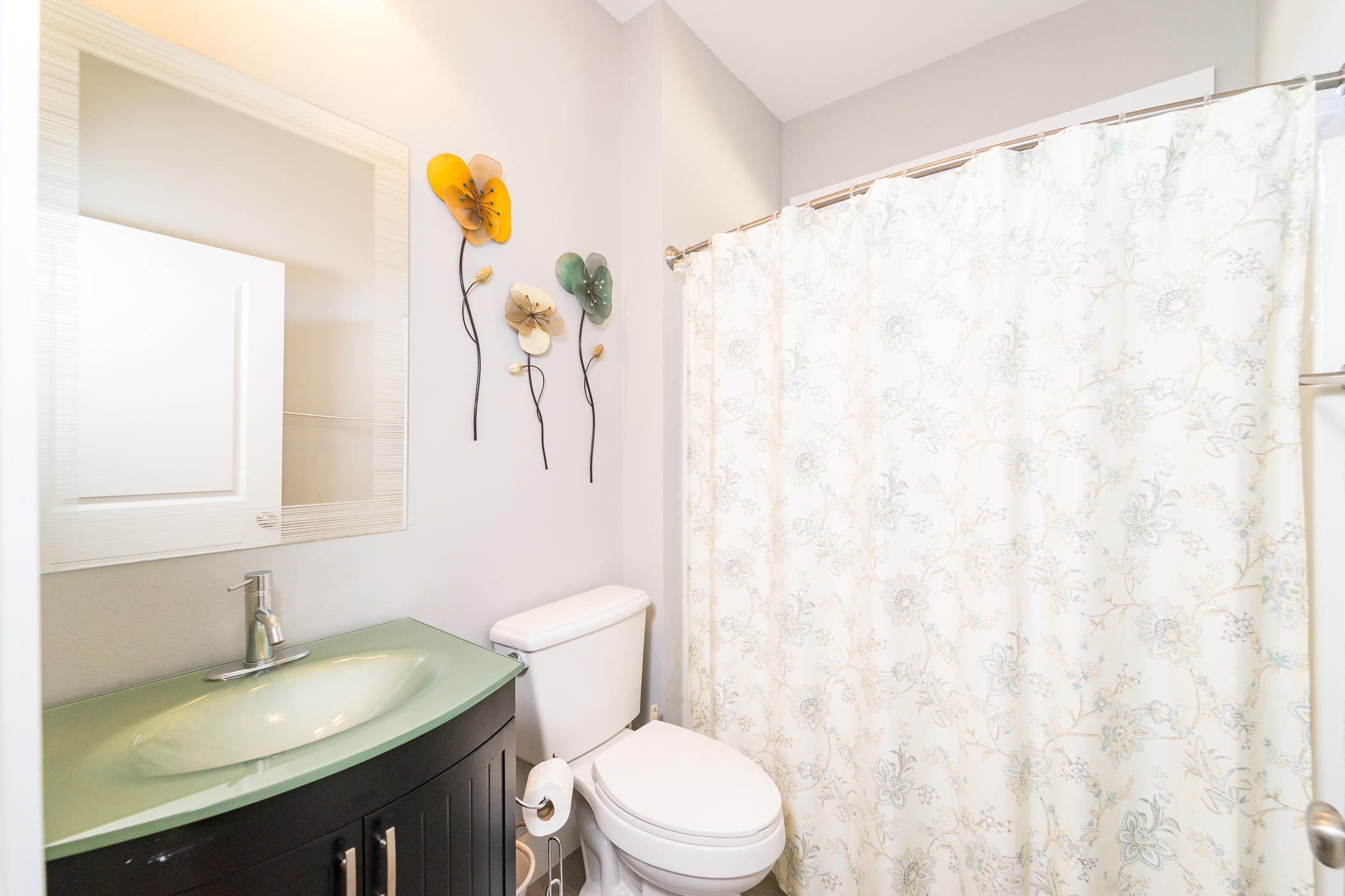 303 Greyfox Circle Crestview, FL 32536 - Photo 20 of 24 a bathroom with a sink vanity mirror and toilet