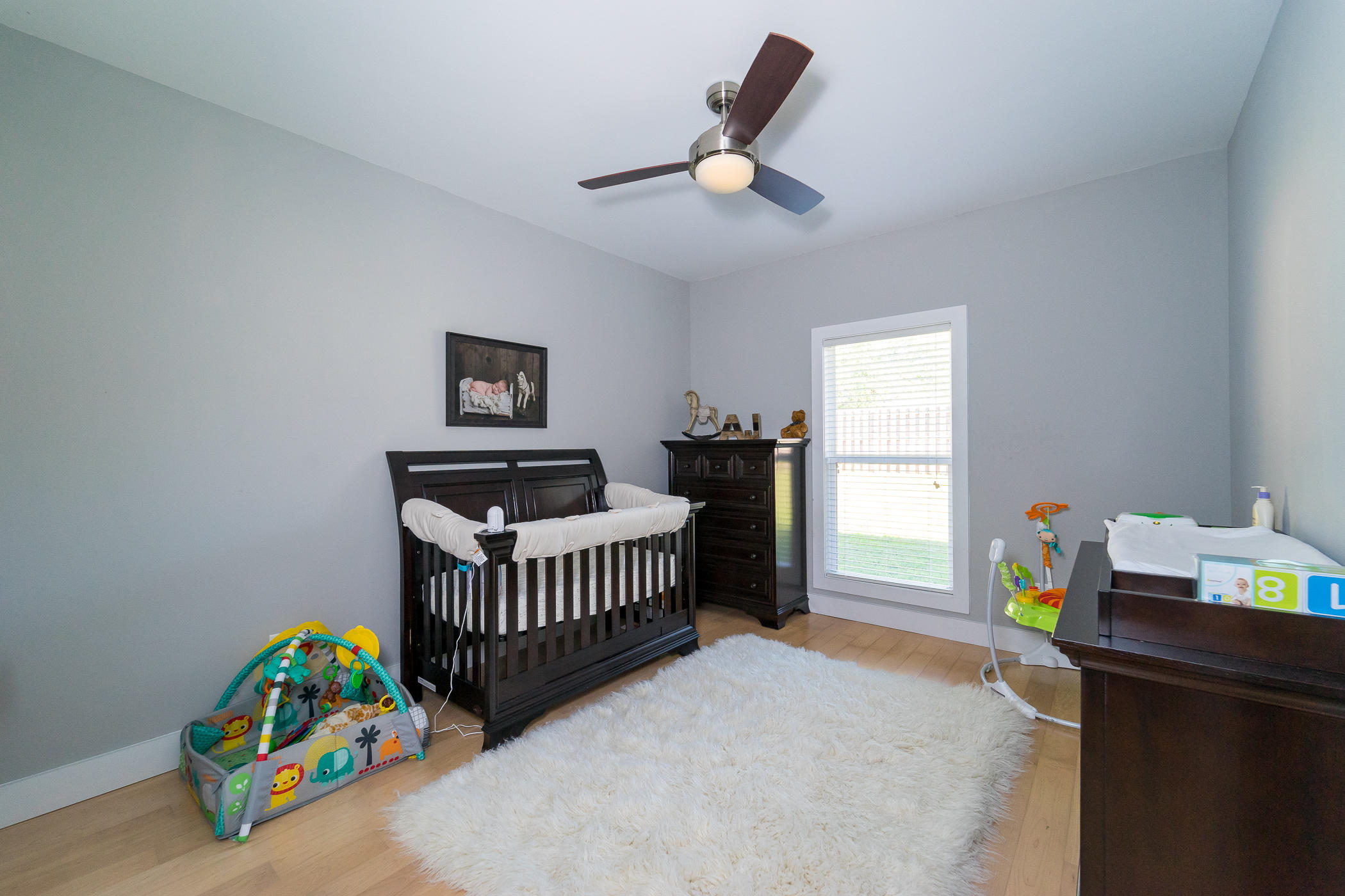 303 Greyfox Circle Crestview, FL 32536 - Photo 21 of 24 a bedroom with a bed and a window