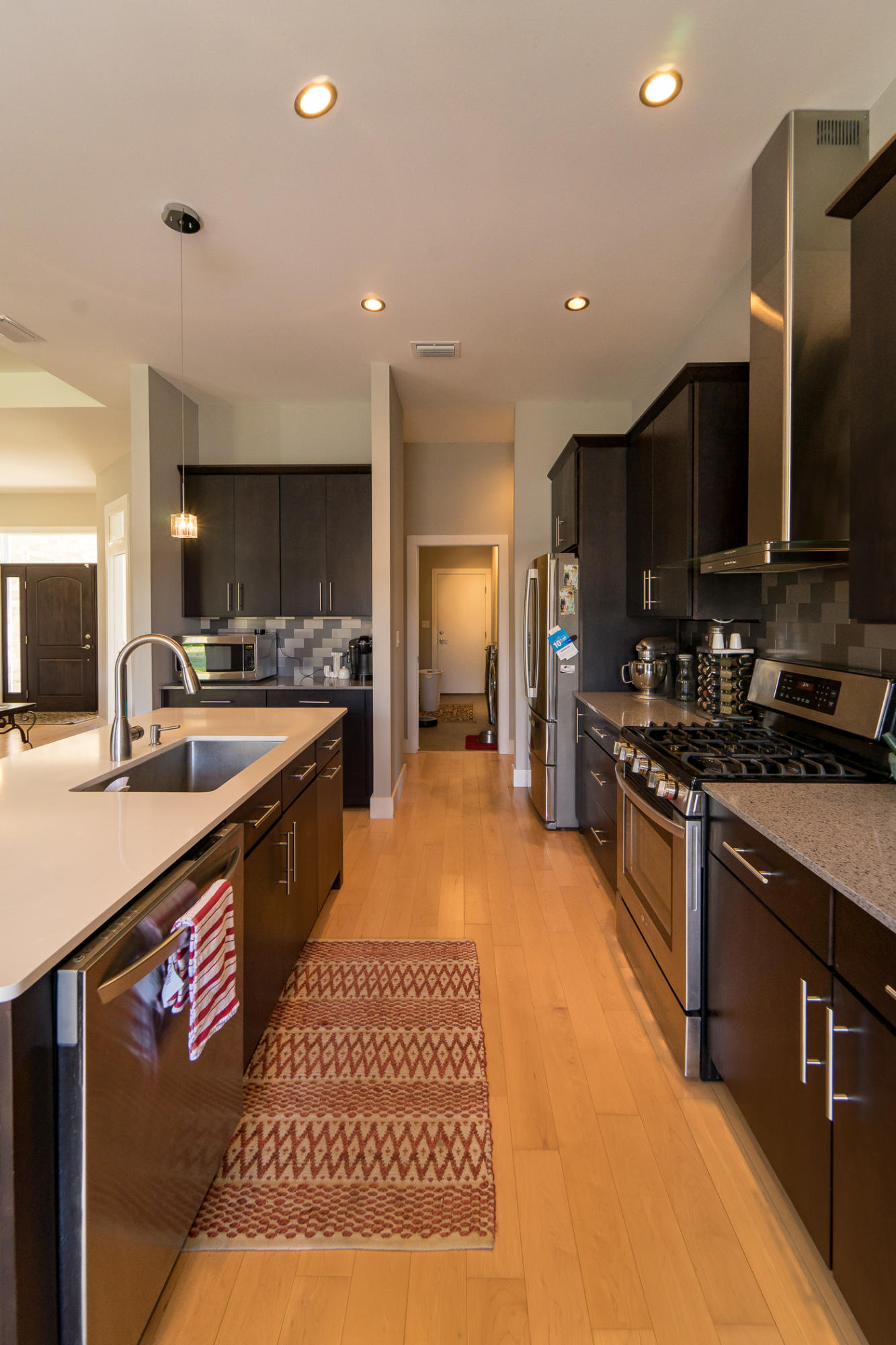 303 Greyfox Circle Crestview, FL 32536 - Photo 8 of 24 a large kitchen with stainless steel appliances and a sink