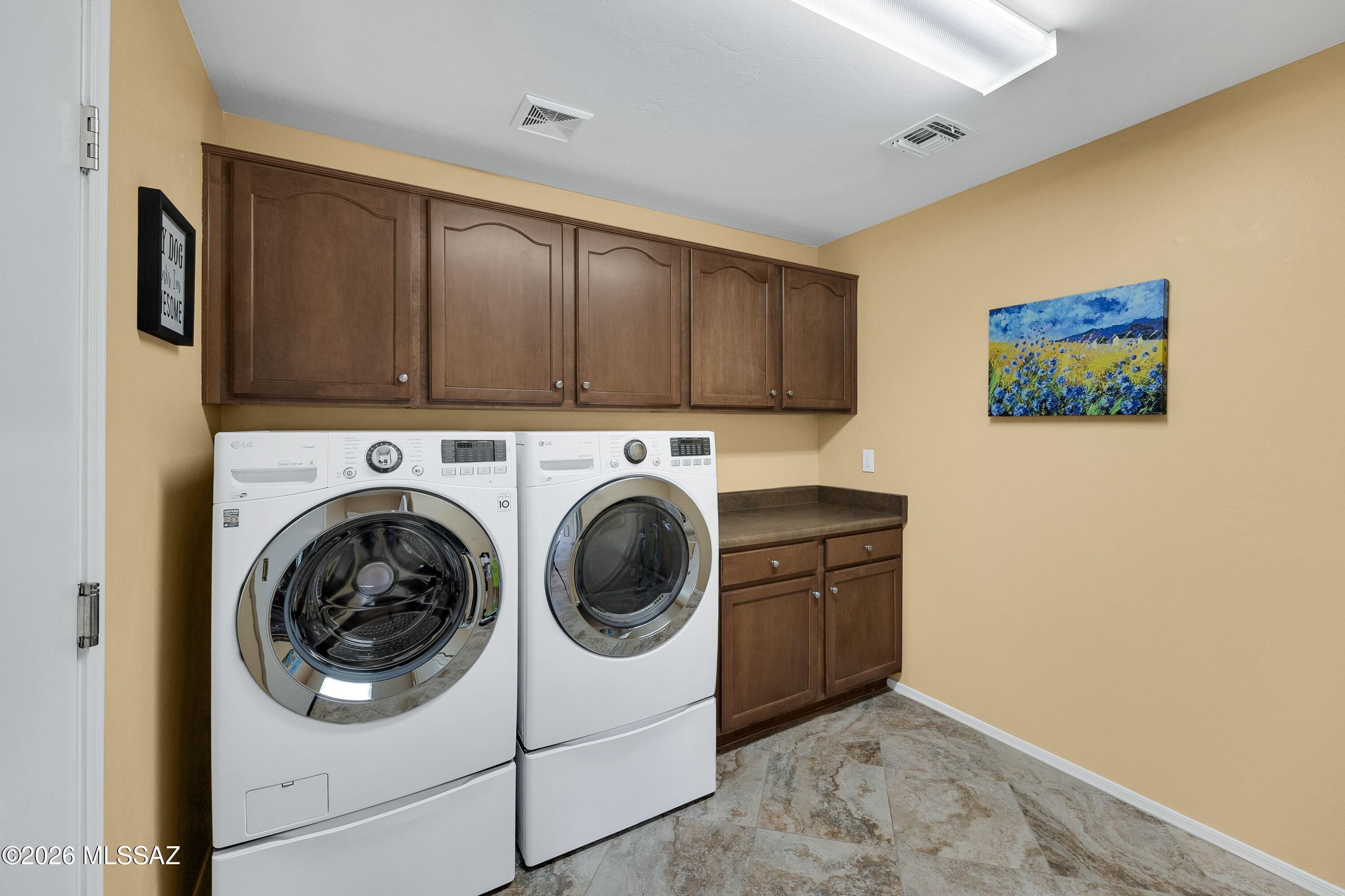 61852 East Sandlewood Road Tucson, AZ 85739 - Photo 19 of 50 Laundry Room has cabinets & counters