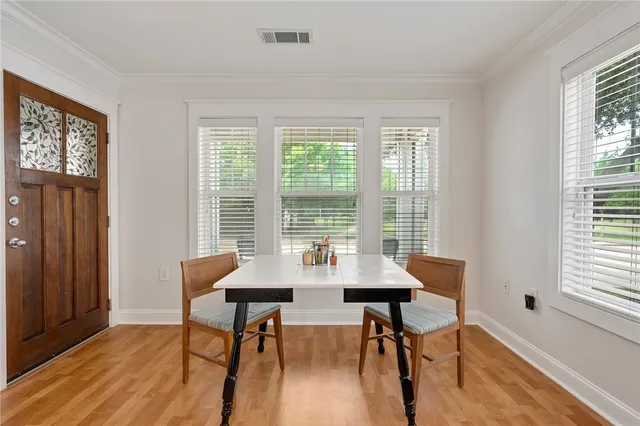 a view of a dining room with furniture window and outside view