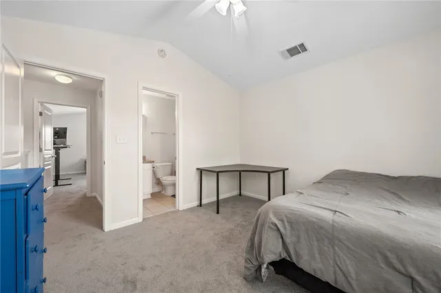 a bedroom with a bed and walk in closet