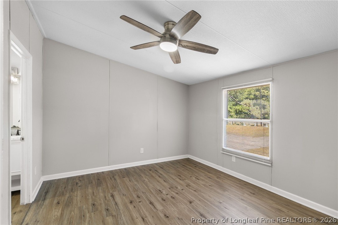 6568 Sandy Creek Road Stedman, NC 28391 - Photo 12 of 34 a view of empty room with wooden floor