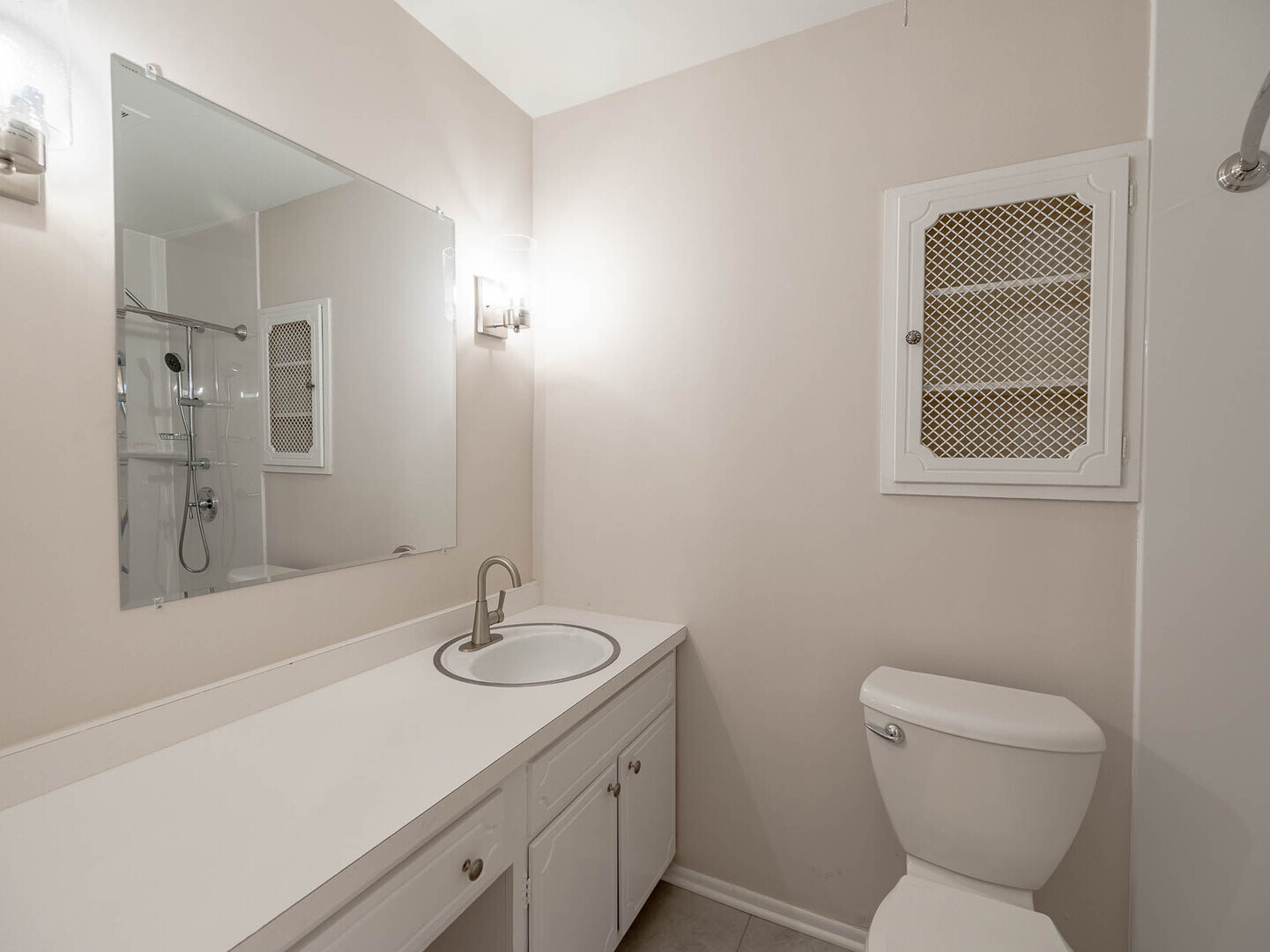 724 Surrey Drive Streamwood, IL 60107 - Photo 11 of 14 a bathroom with a toilet sink and mirror