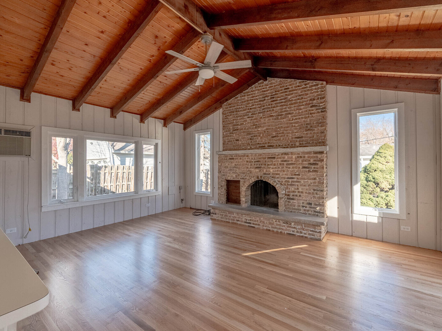 724 Surrey Drive Streamwood, IL 60107 - Photo 5 of 14 a view of empty room with wooden floor and fireplace