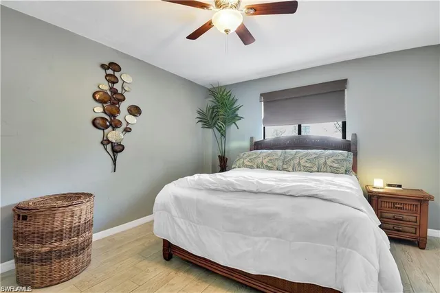 a bedroom with a bed and a chair