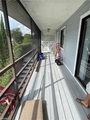 a view of balcony with wooden floor