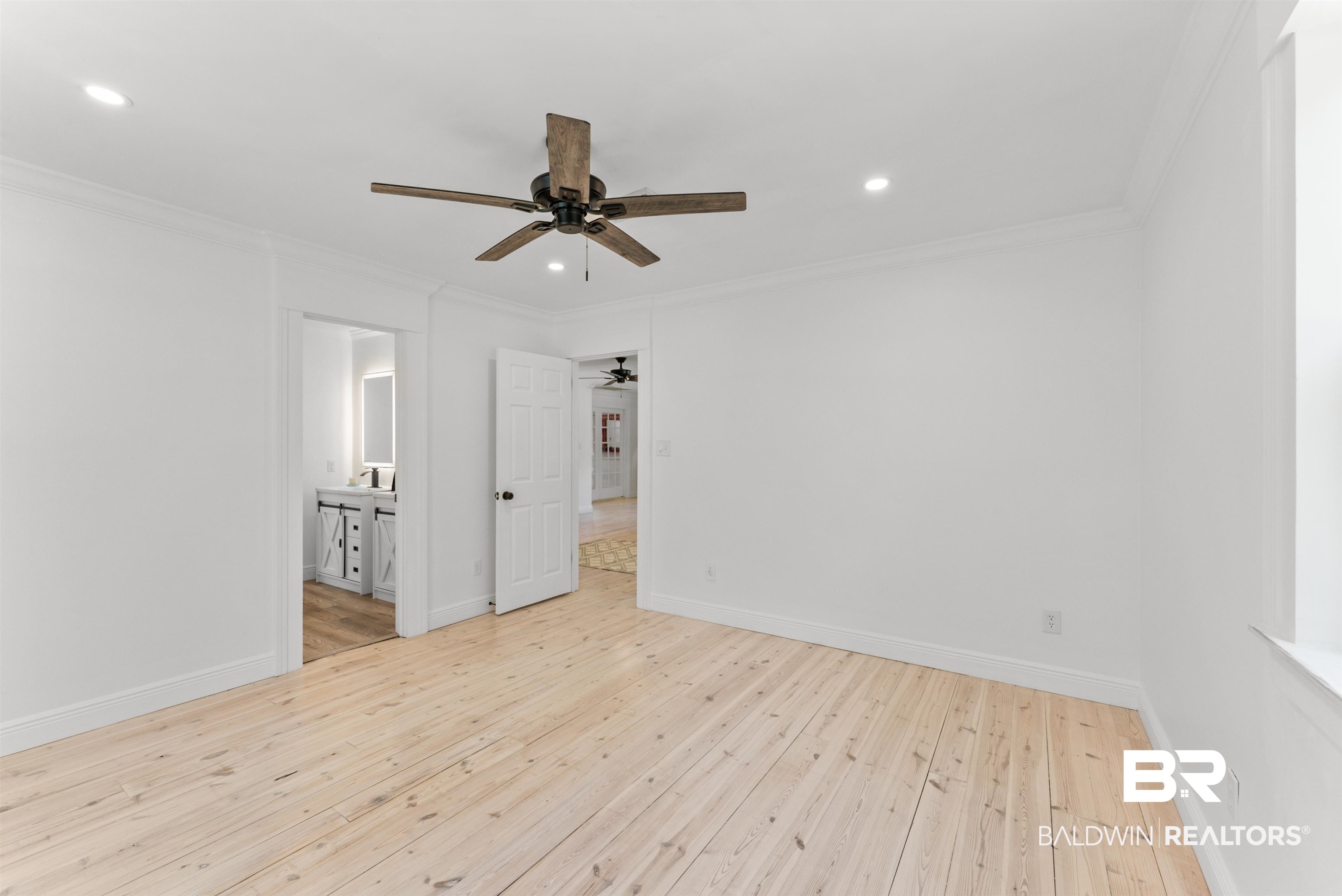 6447 Bemis Lane Bon Secour, AL 36511 - Photo 48 of 62 Bright room featuring light wood flooring, a ceiling fan, recessed lighting, and white trim