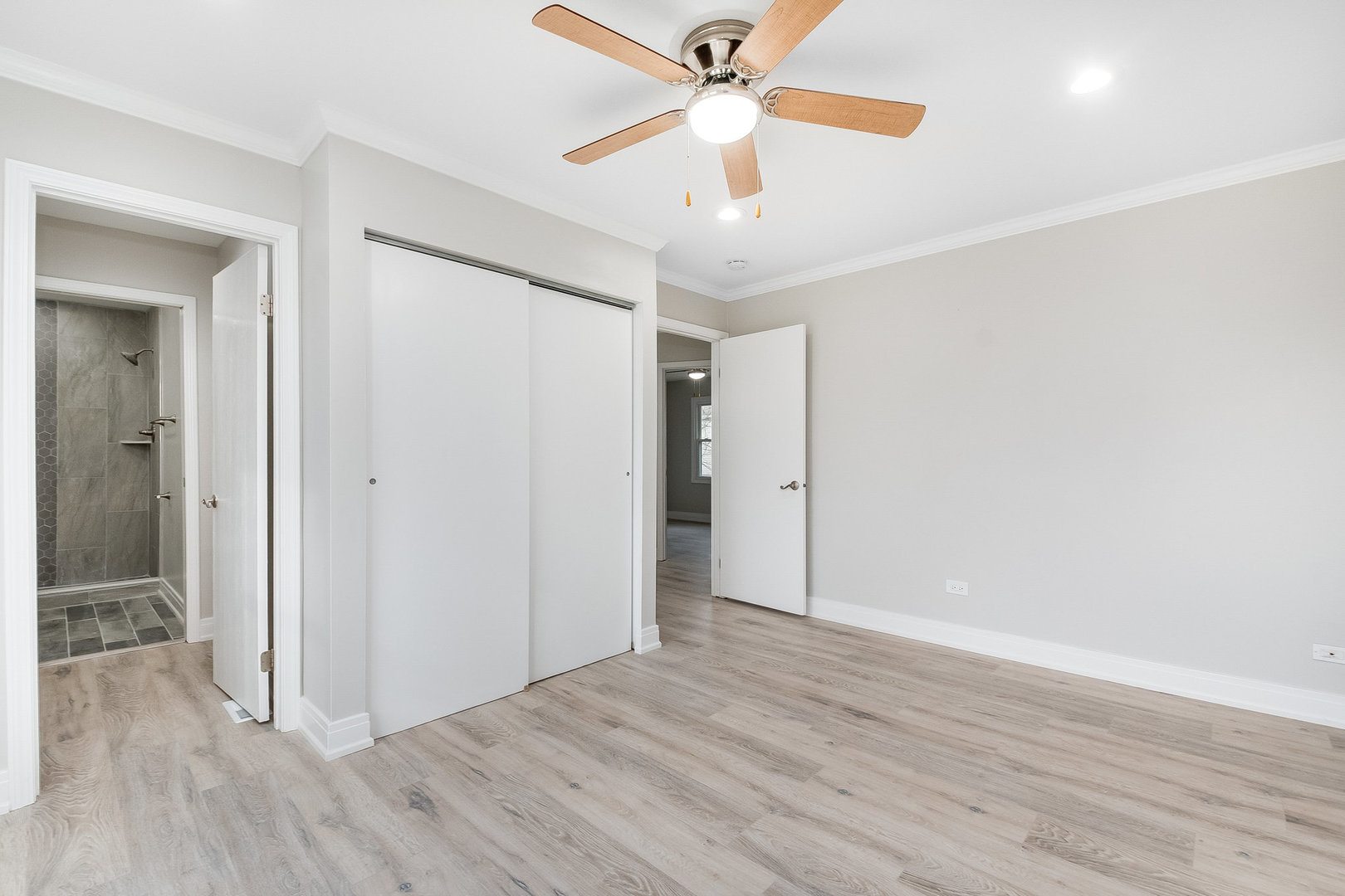235 Hedgerow Drive Bloomingdale, IL 60108 - Photo 15 of 24 a view of an empty room with wooden floor
