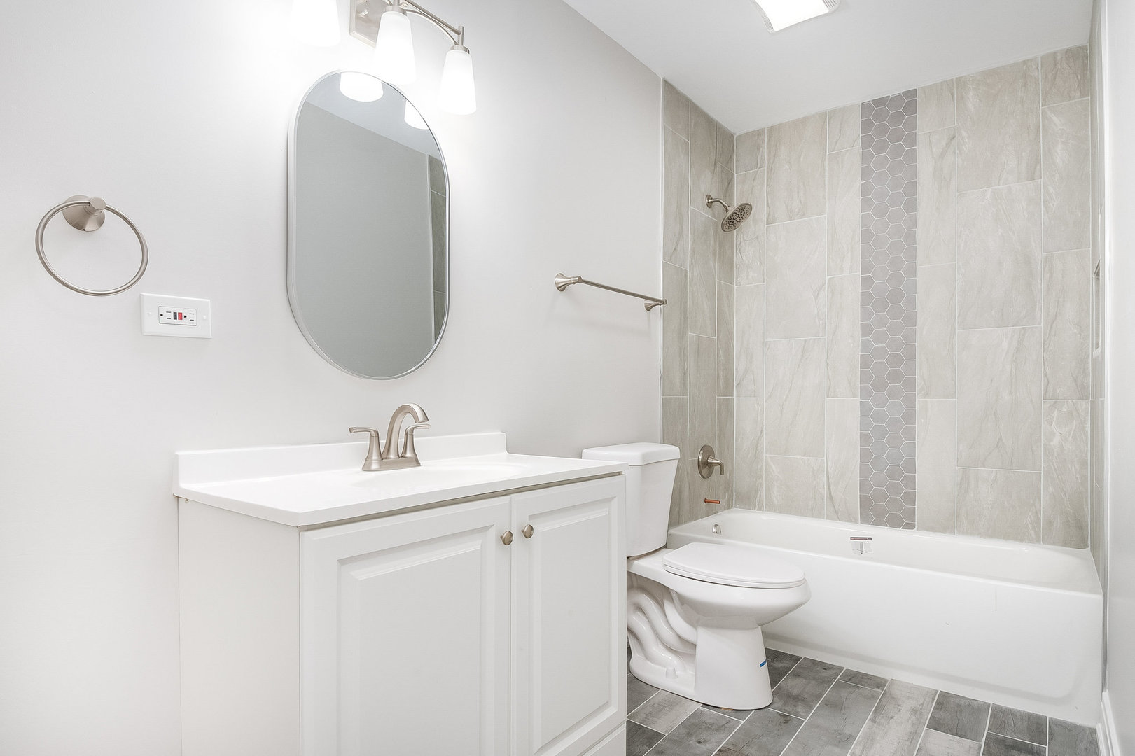 235 Hedgerow Drive Bloomingdale, IL 60108 - Photo 20 of 24 a bathroom with a toilet a sink and a bathtub