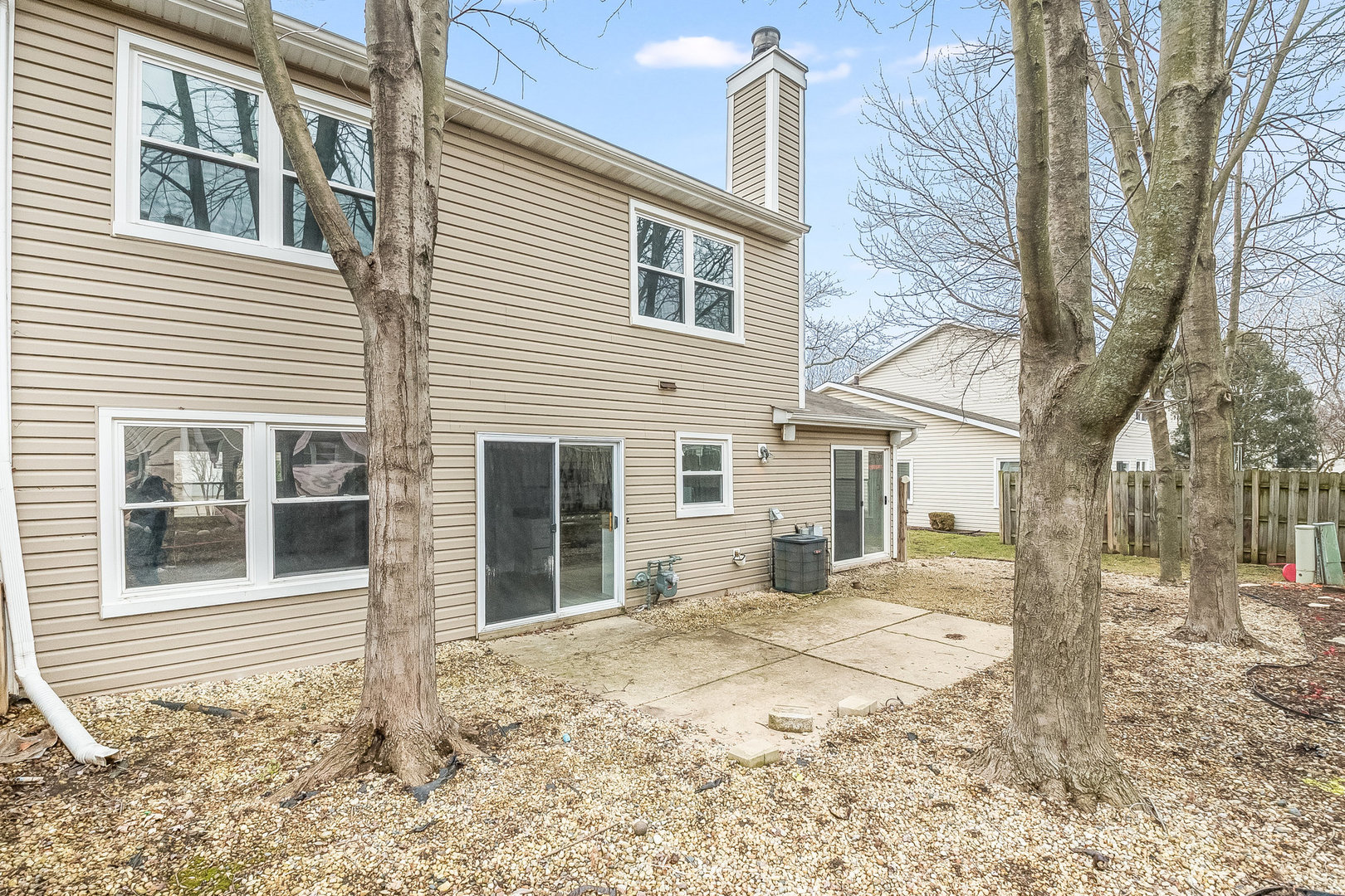 235 Hedgerow Drive Bloomingdale, IL 60108 - Photo 21 of 24 a view of a house with a yard covered in snow
