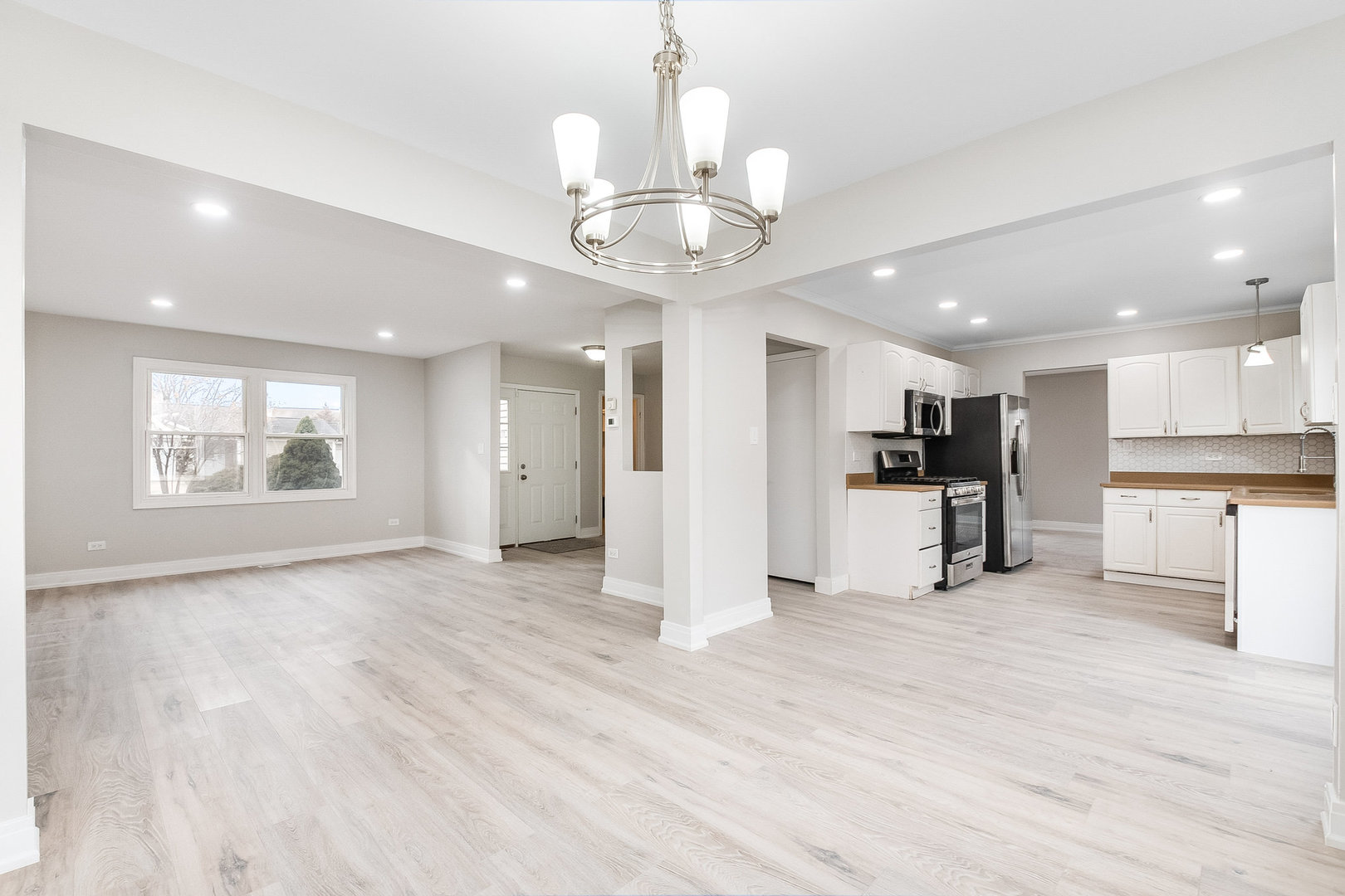 235 Hedgerow Drive Bloomingdale, IL 60108 - Photo 10 of 24 a view of kitchen with refrigerator and window