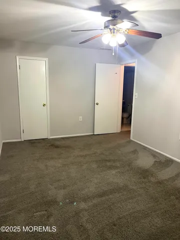 a view of a chandelier fan in a room