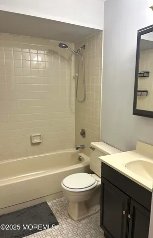 a bathroom with a toilet a sink and bathtub
