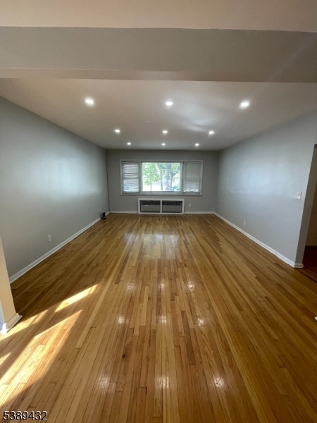 388 Leslie Street Newark, NJ 07112 - Photo 2 of 19 a view of room with wooden floor