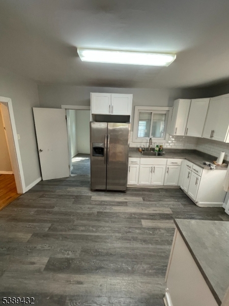 388 Leslie Street Newark, NJ 07112 - Photo 6 of 19 a large kitchen with stainless steel appliances granite countertop a refrigerator a stove and a sink