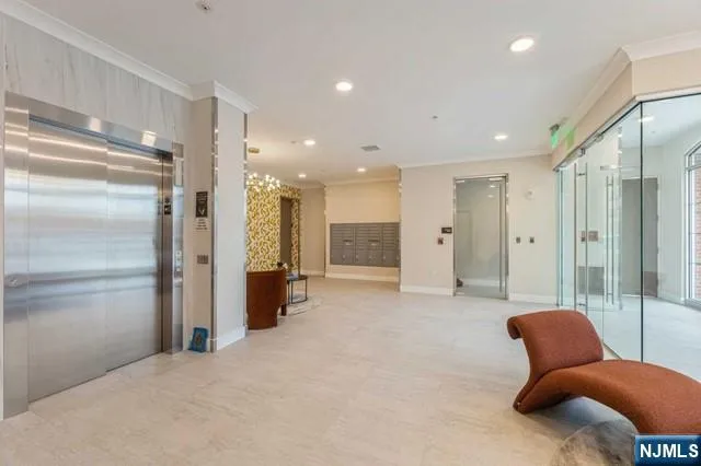 a view of a livingroom with furniture and a ceiling fan