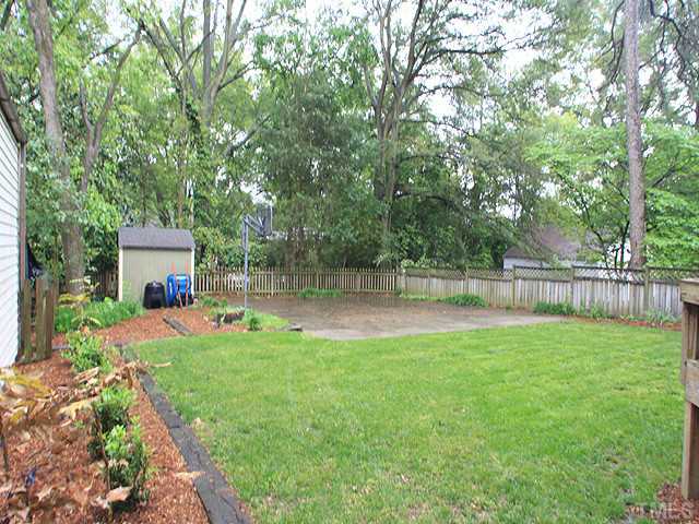 16 Henderson Street Raleigh, NC 27607 - Photo 11 of 12 a backyard of a house with table and chairs
