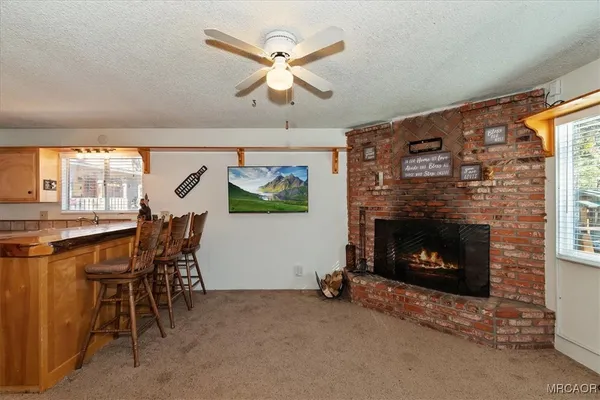 a dining room with furniture and a fireplace