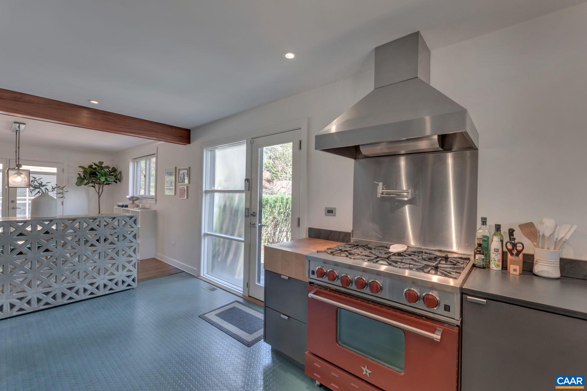 1717 Meadowbrook Heights Road Charlottesville, VA 22901 - Photo 12 of 43 a kitchen with stainless steel appliances granite countertop a stove and a wooden floors