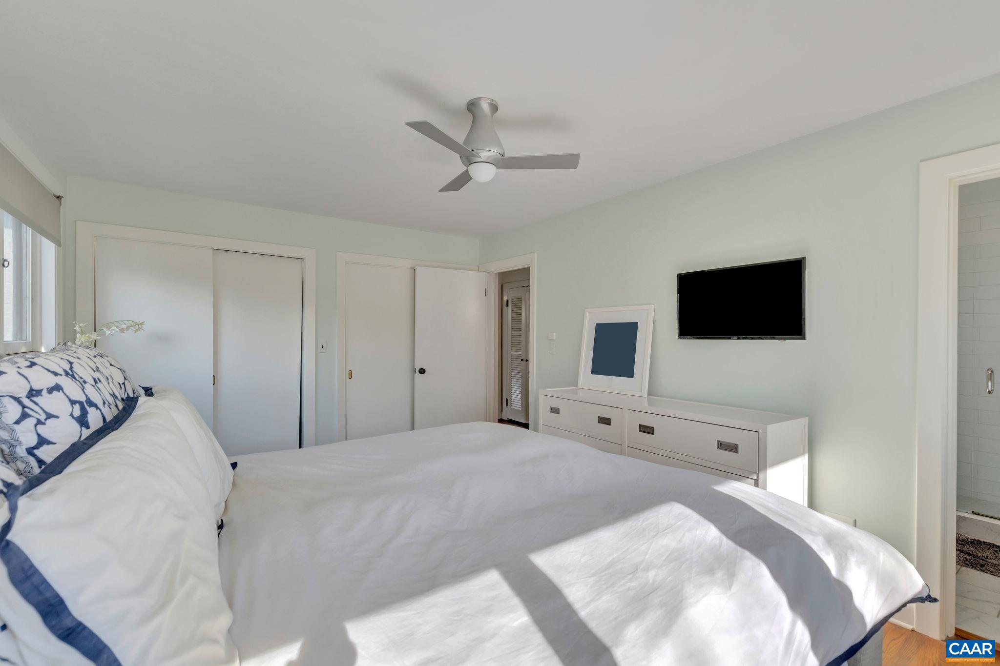 1717 Meadowbrook Heights Road Charlottesville, VA 22901 - Photo 17 of 43 a bedroom with a bed and a flat screen tv