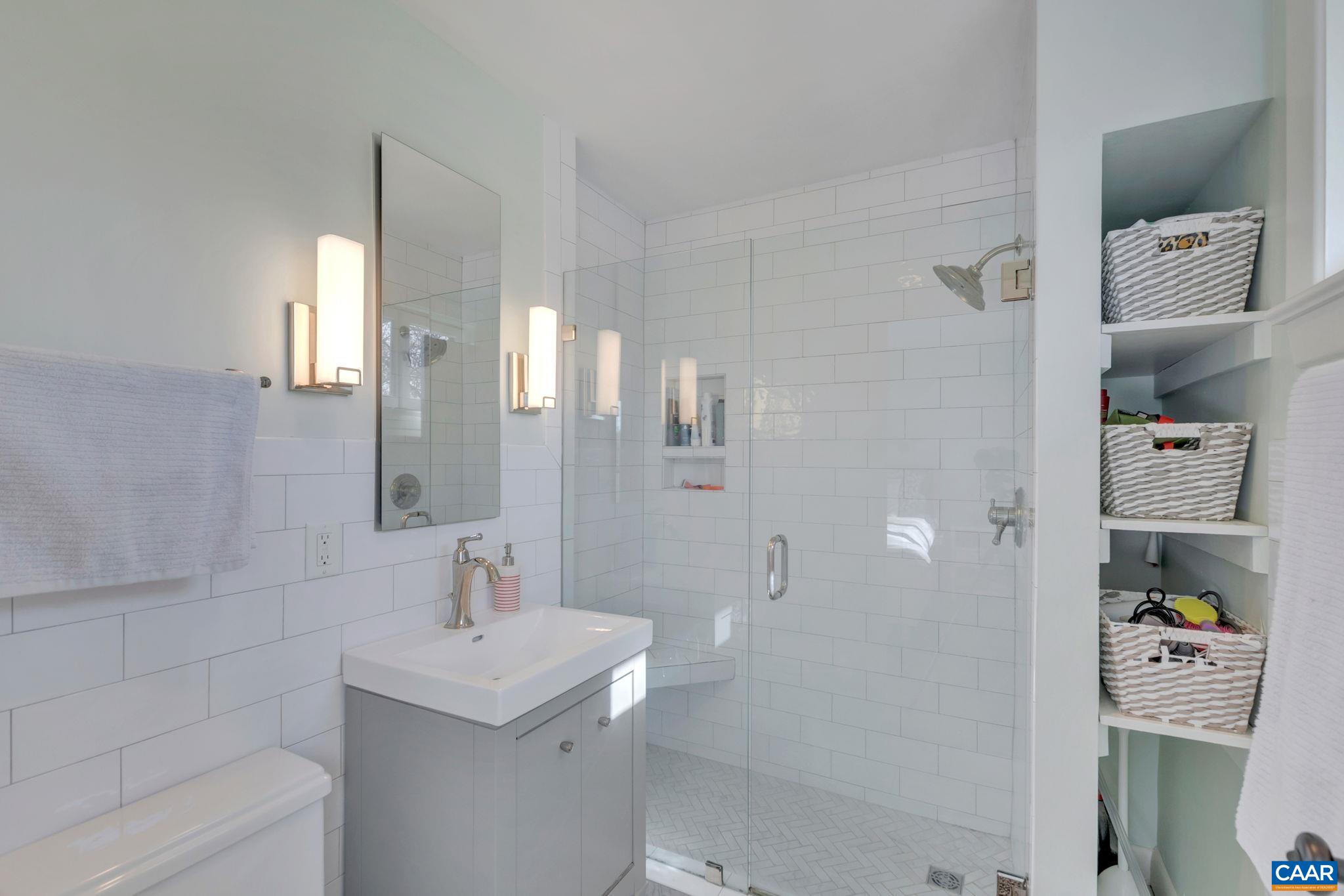 1717 Meadowbrook Heights Road Charlottesville, VA 22901 - Photo 18 of 43 a bathroom with a sink a toilet and shower