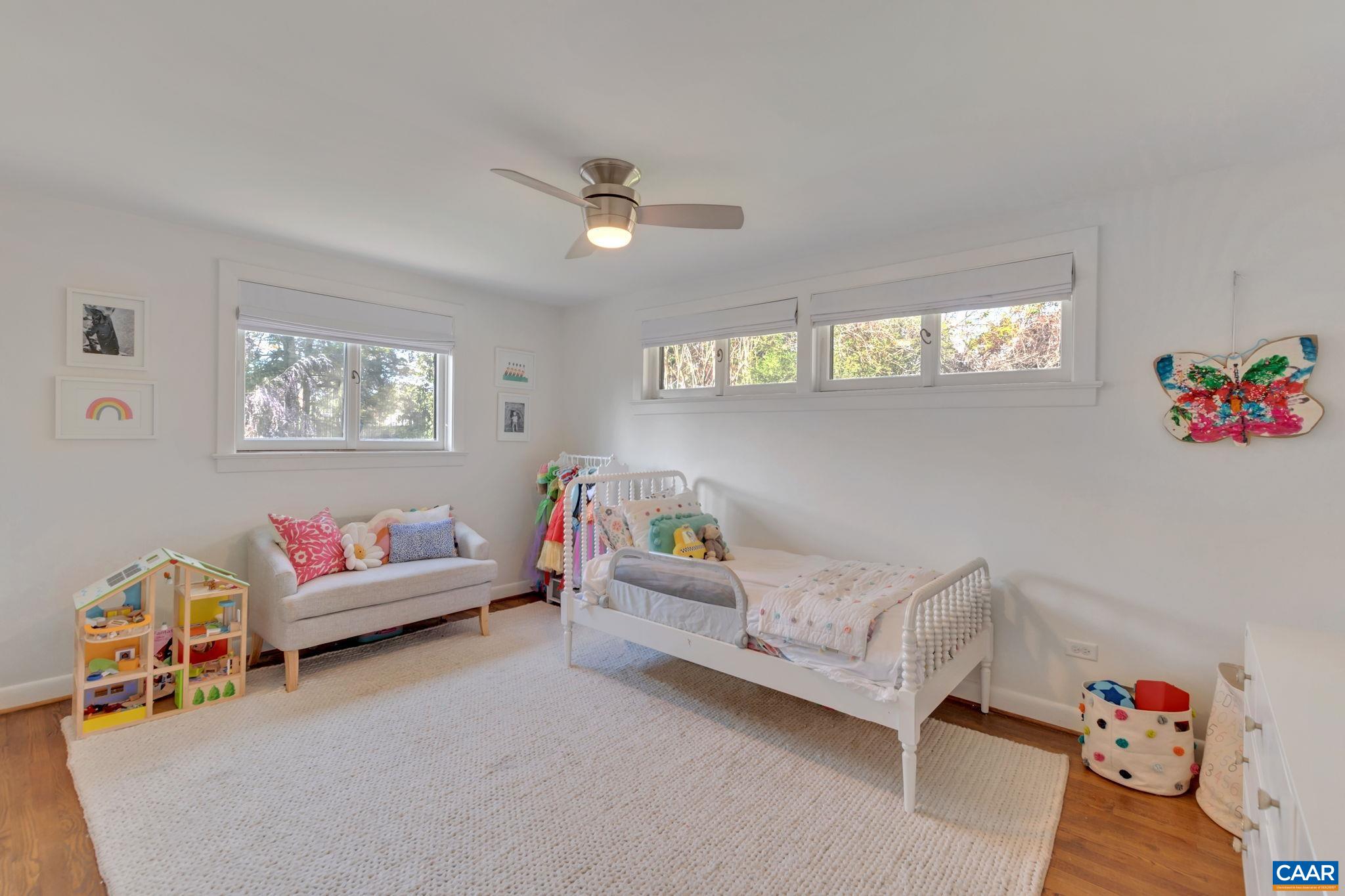 1717 Meadowbrook Heights Road Charlottesville, VA 22901 - Photo 19 of 43 a living room with furniture and a window