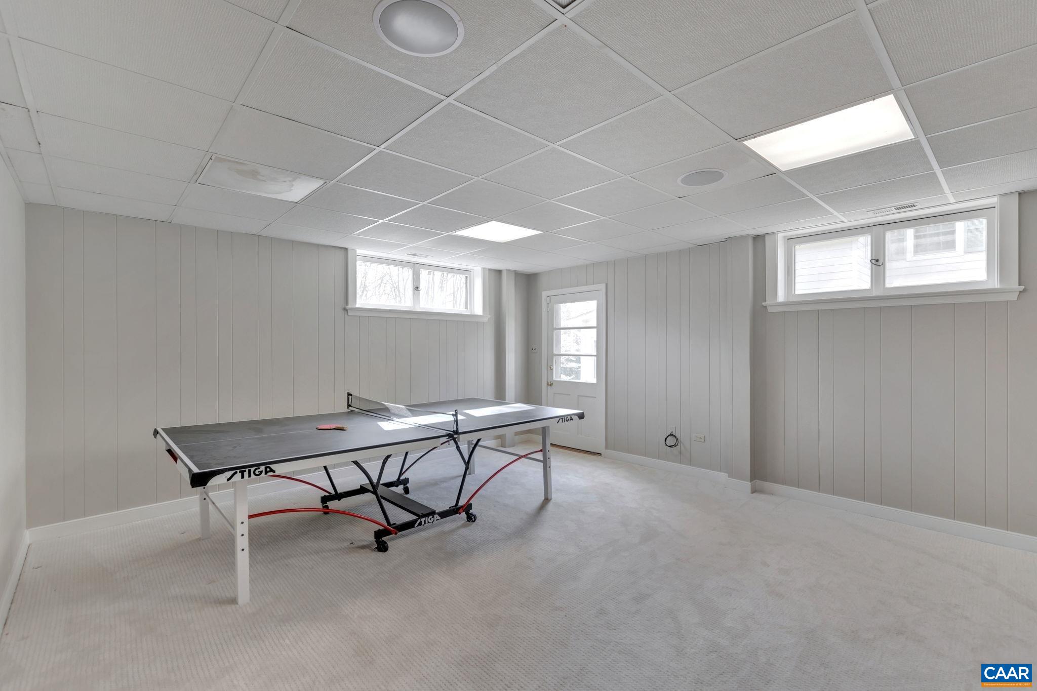 1717 Meadowbrook Heights Road Charlottesville, VA 22901 - Photo 25 of 43 a view of a workspace with furniture and a window