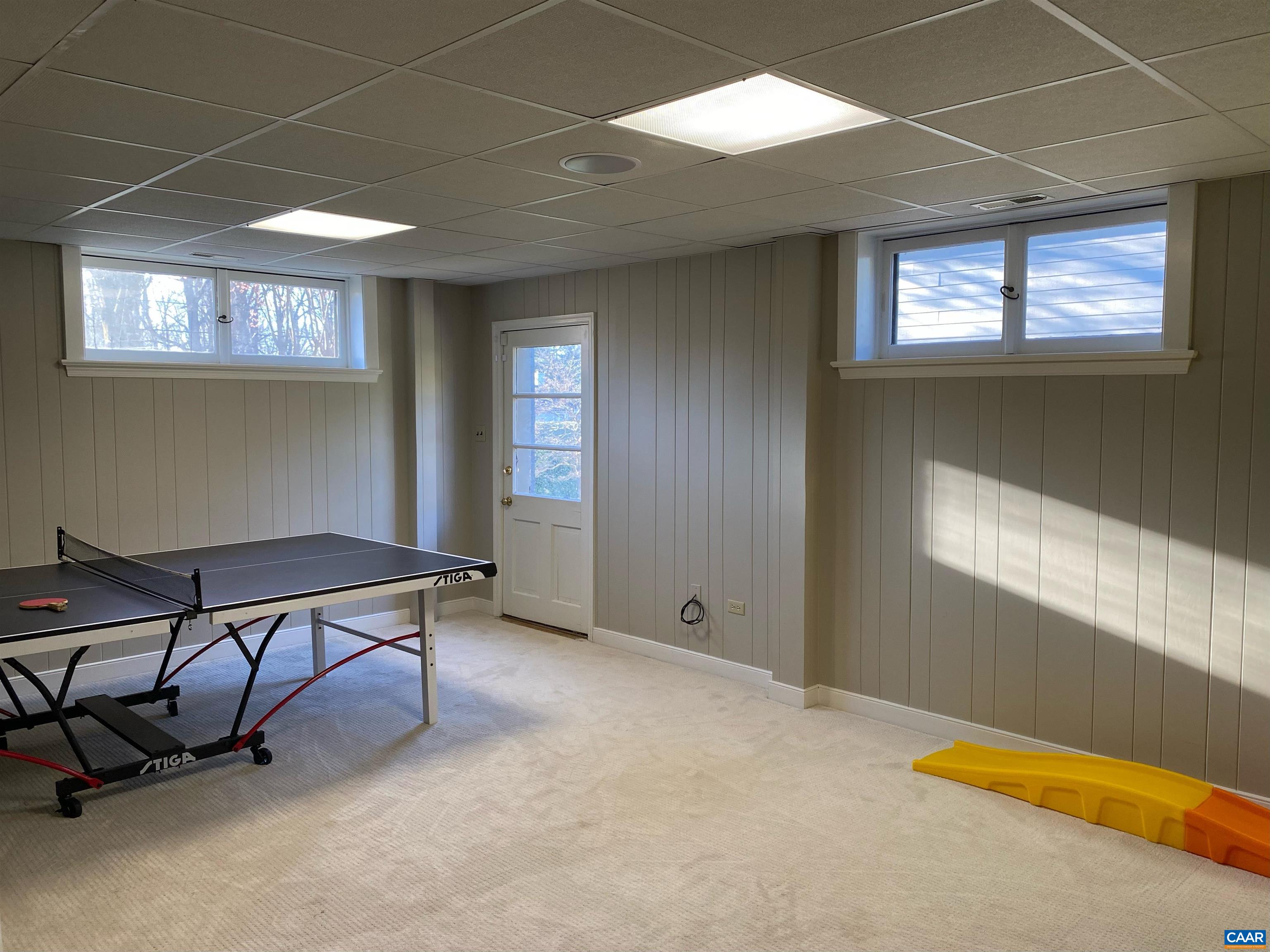1717 Meadowbrook Heights Road Charlottesville, VA 22901 - Photo 27 of 43 a view of a livingroom with furniture and a window