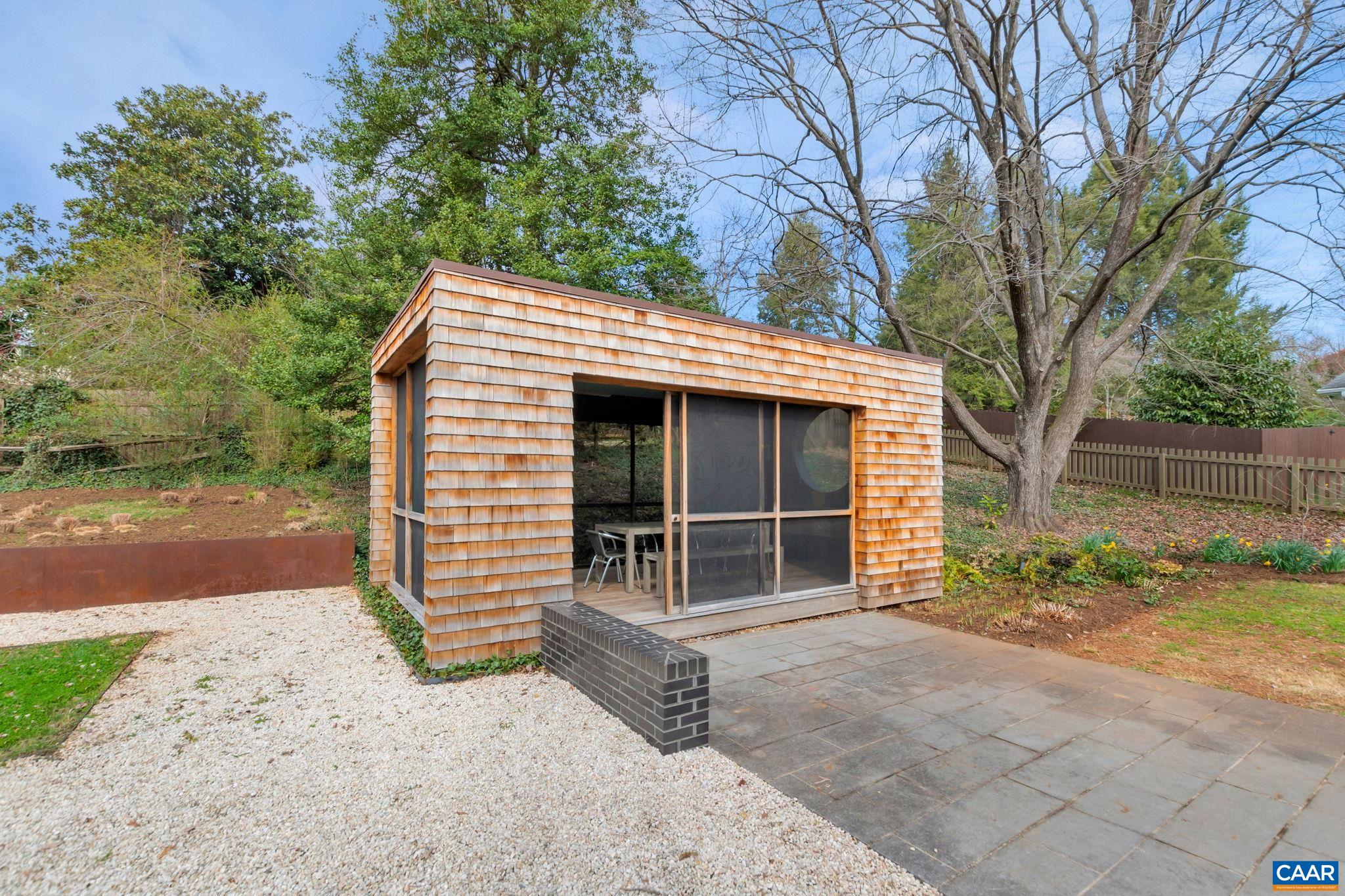 1717 Meadowbrook Heights Road Charlottesville, VA 22901 - Photo 32 of 43 a front view of a house with garden