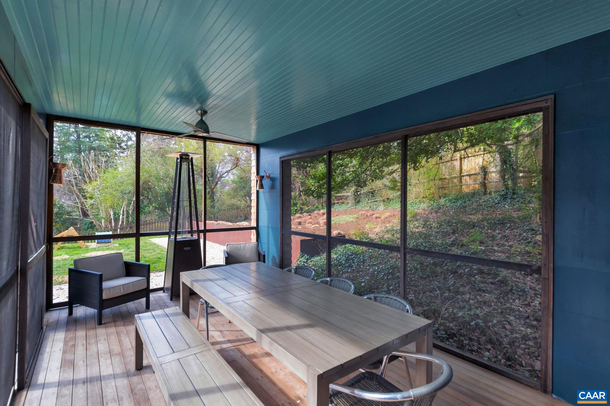 1717 Meadowbrook Heights Road Charlottesville, VA 22901 - Photo 35 of 43 a view of a patio with table and chairs potted plants with wooden floor
