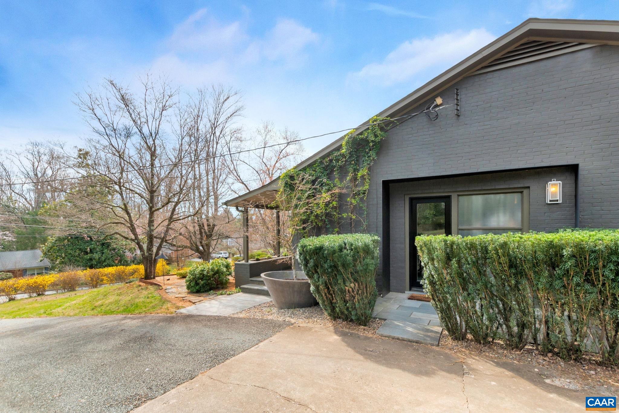 1717 Meadowbrook Heights Road Charlottesville, VA 22901 - Photo 39 of 43 a view of a house with a large tree and plants