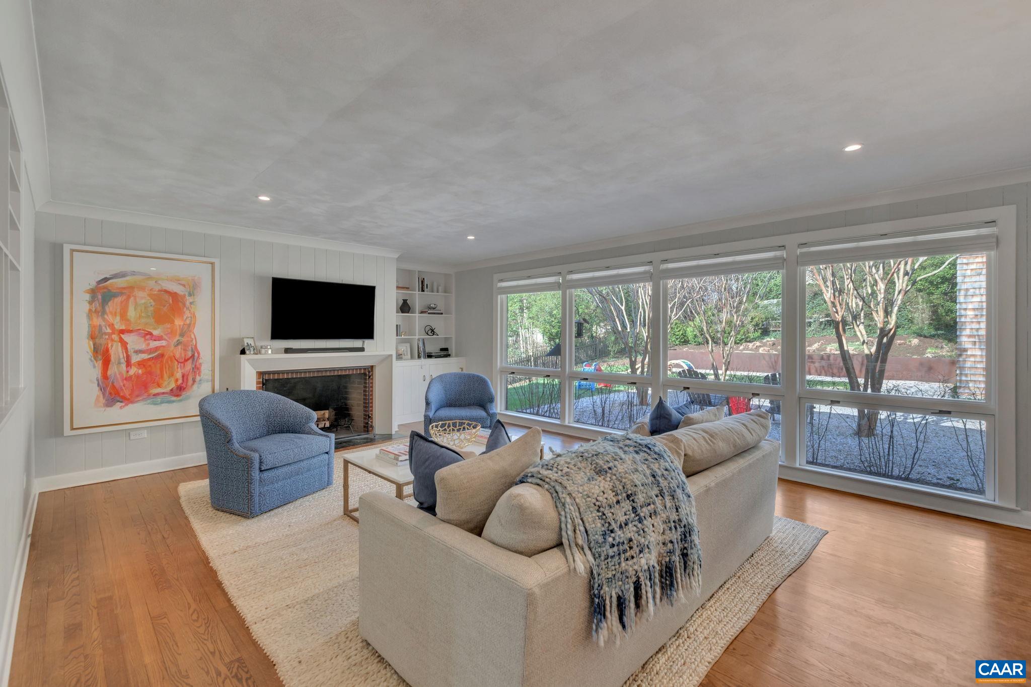 1717 Meadowbrook Heights Road Charlottesville, VA 22901 - Photo 4 of 43 a living room with furniture and large windows