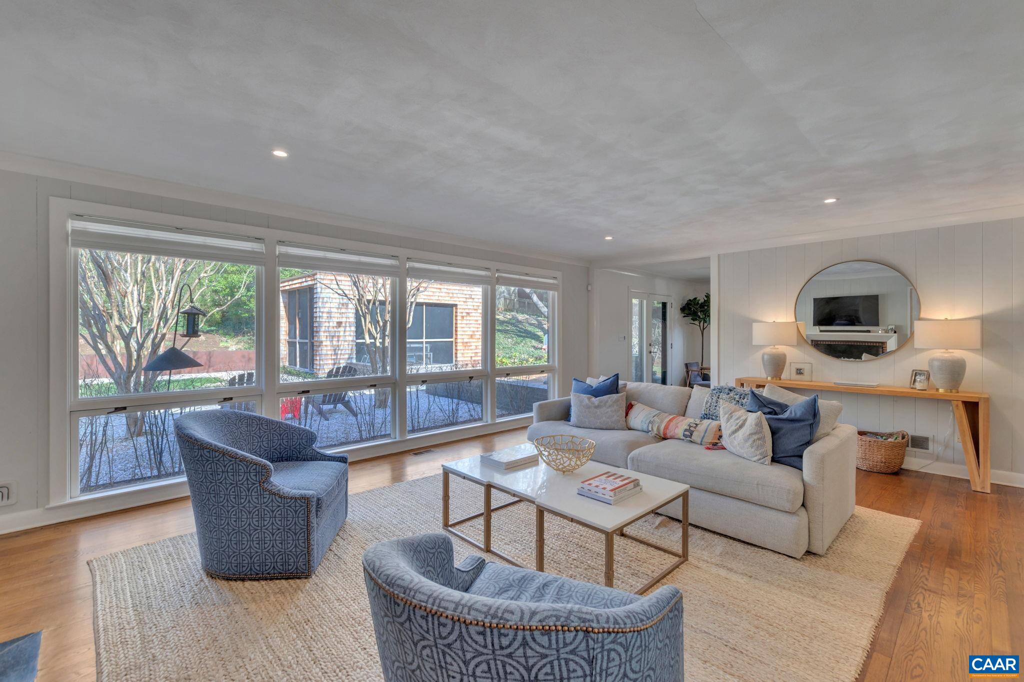 1717 Meadowbrook Heights Road Charlottesville, VA 22901 - Photo 5 of 43 a living room with furniture and a large window