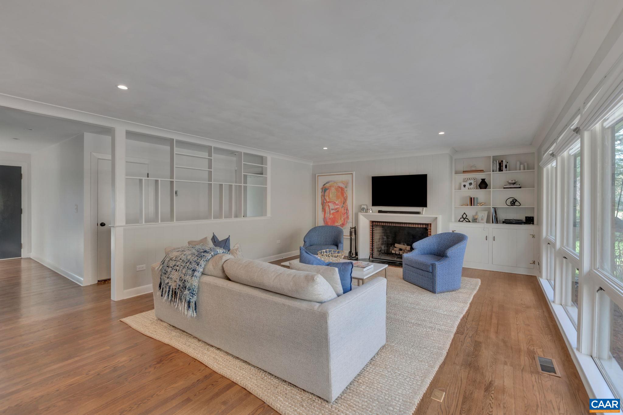 1717 Meadowbrook Heights Road Charlottesville, VA 22901 - Photo 6 of 43 a living room with furniture and a flat screen tv