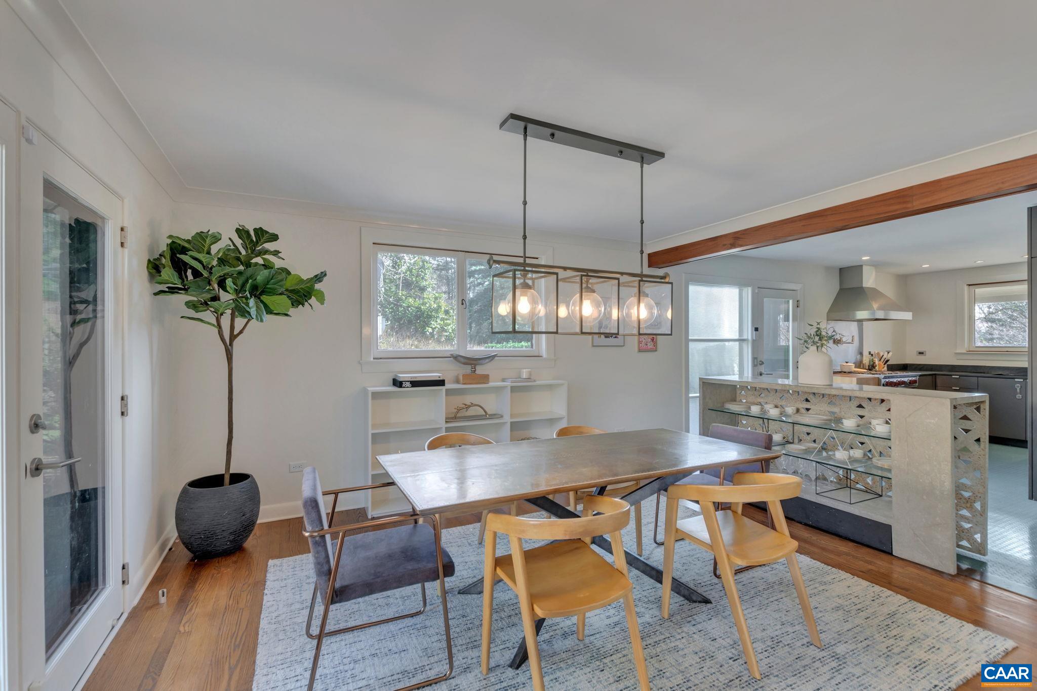 1717 Meadowbrook Heights Road Charlottesville, VA 22901 - Photo 8 of 43 a view of a dining room with furniture and wooden floor