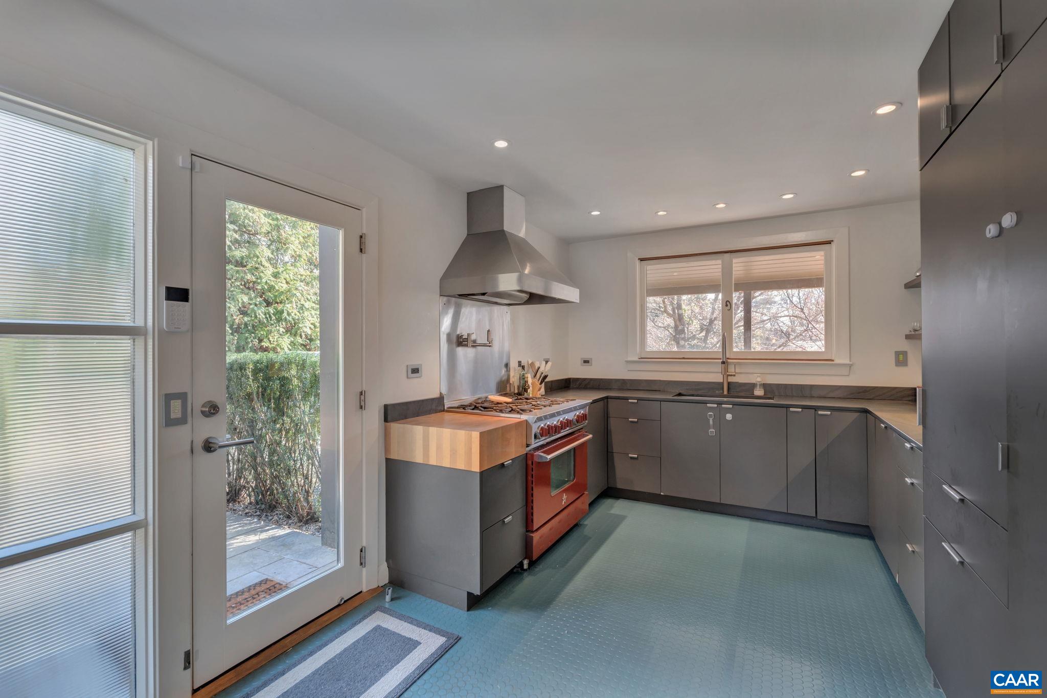 1717 Meadowbrook Heights Road Charlottesville, VA 22901 - Photo 10 of 43 a kitchen with stainless steel appliances granite countertop a stove and a refrigerator