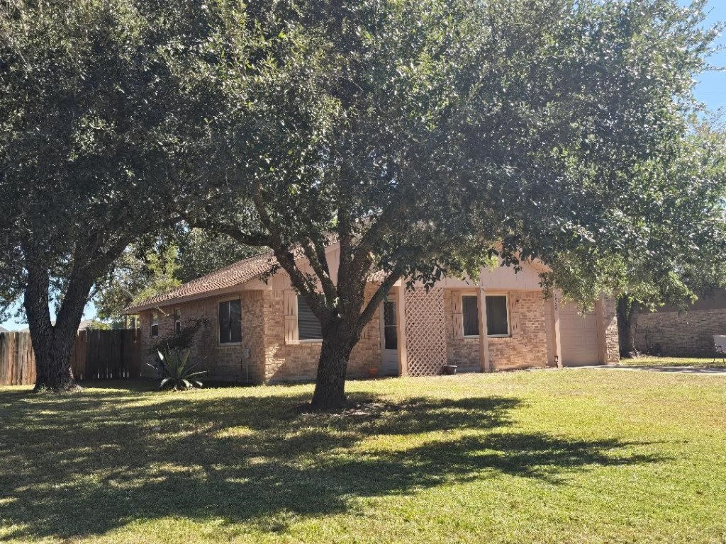 1930 5th Street Hempstead, TX 77445 - Photo 1 of 24 a front view of a house with a yard