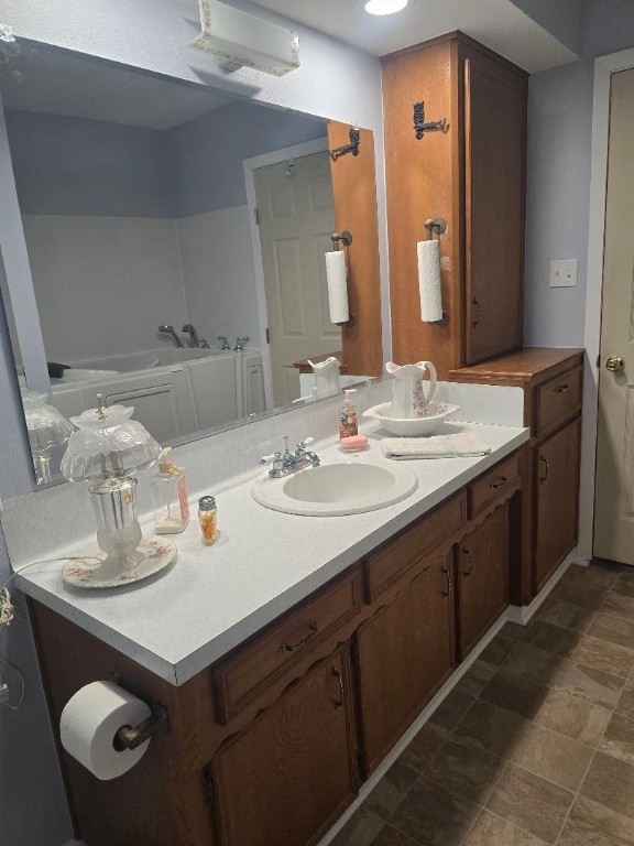 1930 5th Street Hempstead, TX 77445 - Photo 16 of 24 a bathroom with a sink and a mirror