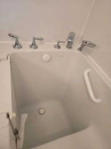 a bathroom with a sink and mirror
