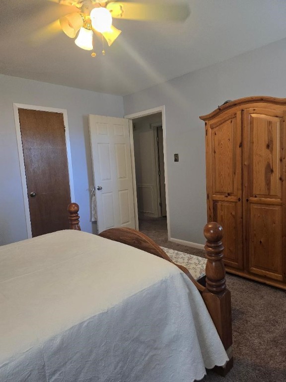 1930 5th Street Hempstead, TX 77445 - Photo 20 of 24 a bedroom with a bed and a chandelier