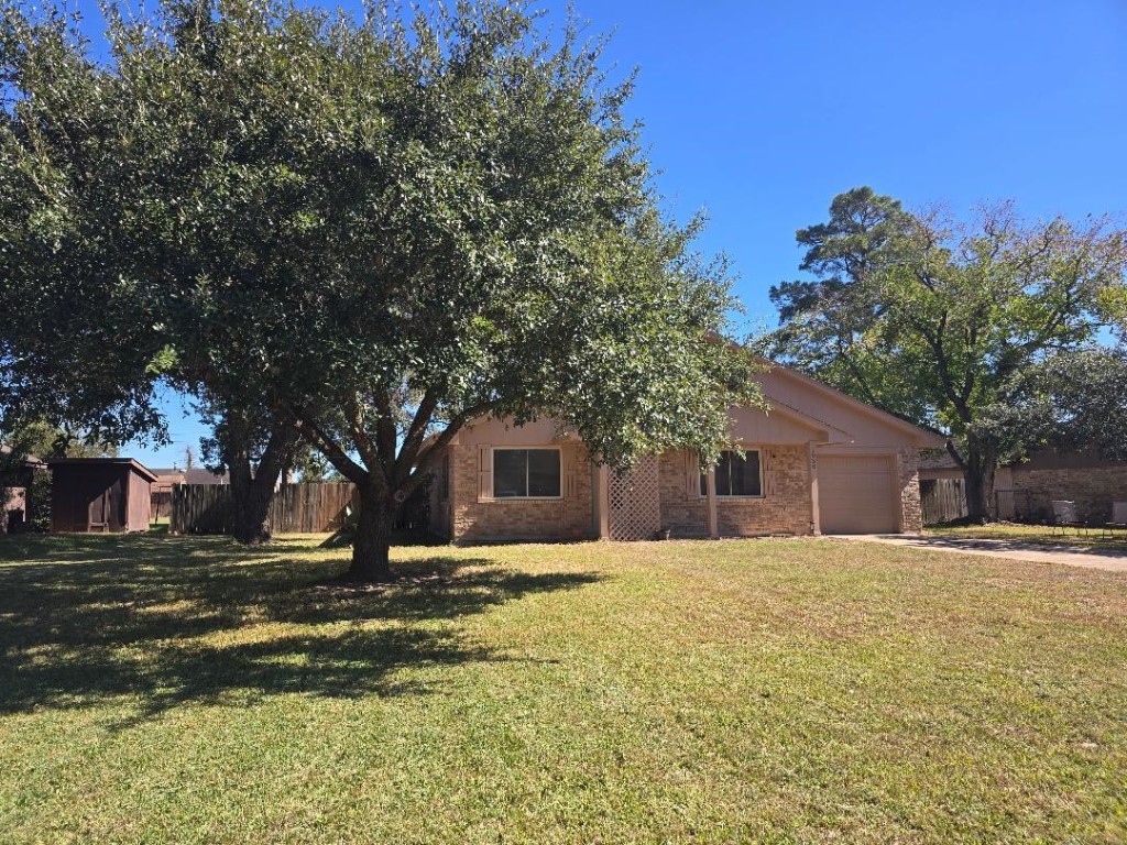 1930 5th Street Hempstead, TX 77445 - Photo 4 of 24 a house that has a tree in front of it