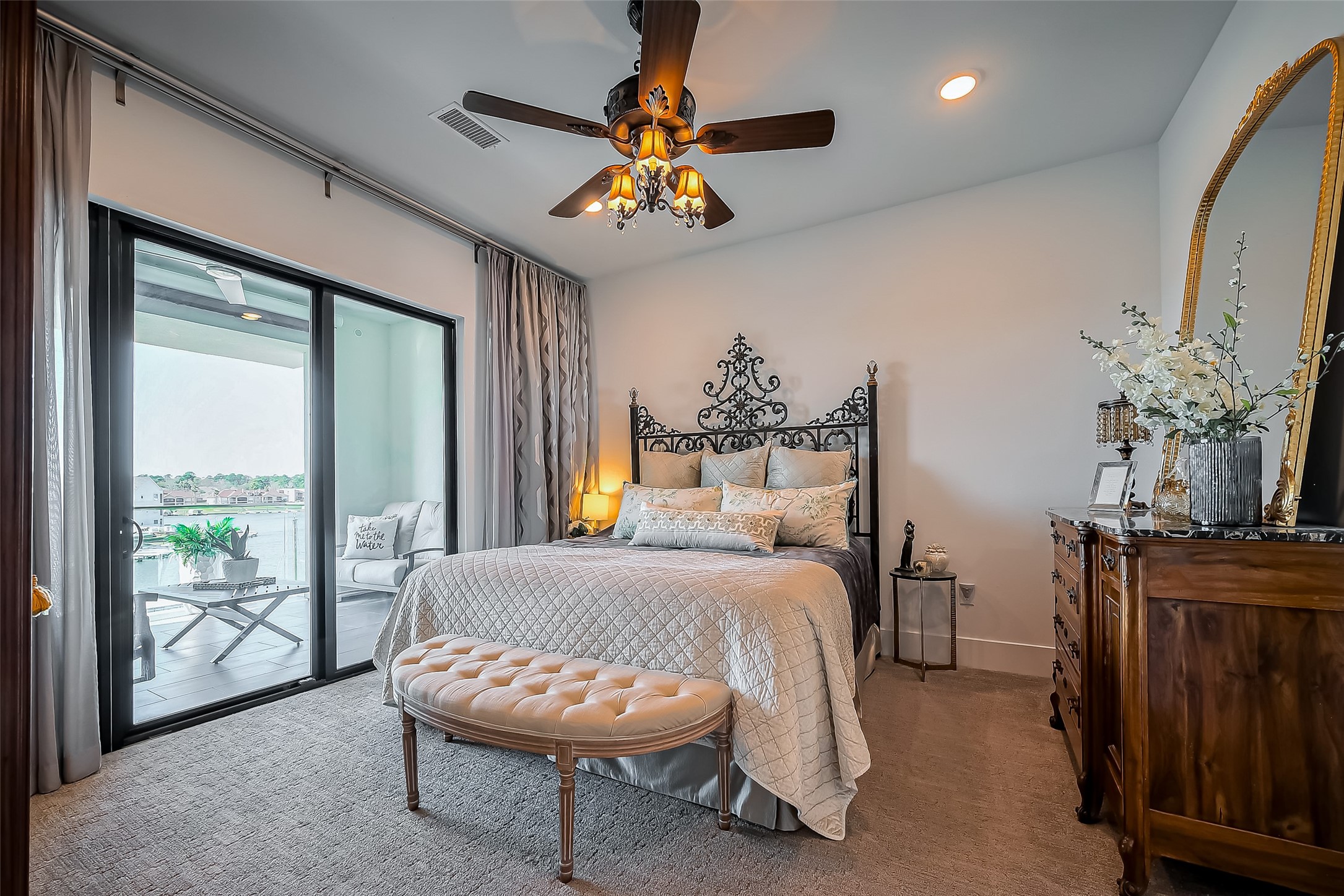199 Waterpoint Court, Unit 302 Conroe, TX 77356 - Photo 9 of 20 The primary suite offers unparalleled comfort and a private balcony with panoramic lake views. A peaceful retreat like no other!