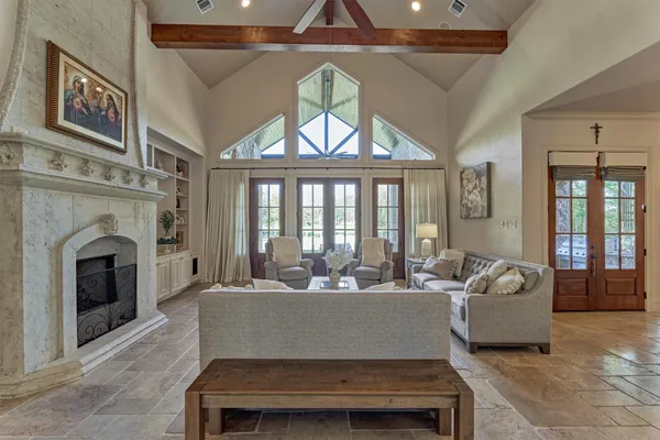 a living room with furniture and a large window