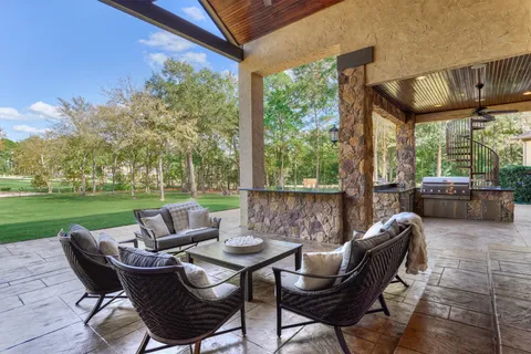 a patio with patio a couch and chairs